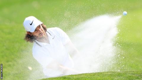 Tommy Fleetwood hits out of a bunker during round one of the Players Championship at Sawgrass