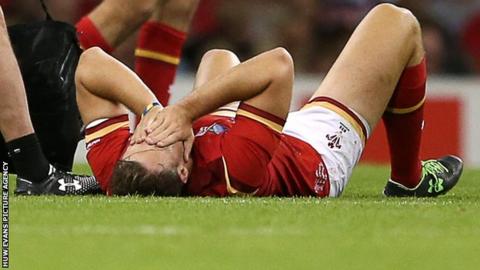 Cory Allen lies down injured