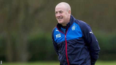 Rangers' boss Mark Warburton all smiles at training