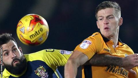 Rhys Healey in action for Newport County