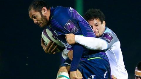 Connacht's George Naoupu is tackled by Newcastle's Tom Penny in Galway