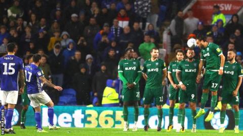 Lee Tomlin's free-kick skims the Wednesday wall before finding the net for Cardiff's equaliser