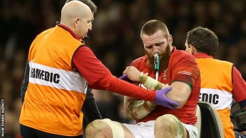 Jake Ball leaves the field after dislocating his shoulder playing for Wales against New Zealand