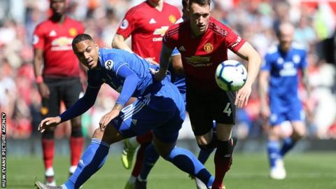 Kenneth Zohore challenges Manchester United's Phil Jones