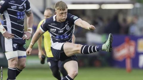 Cory Aston kicks a penalty for Featherstone against Halifax