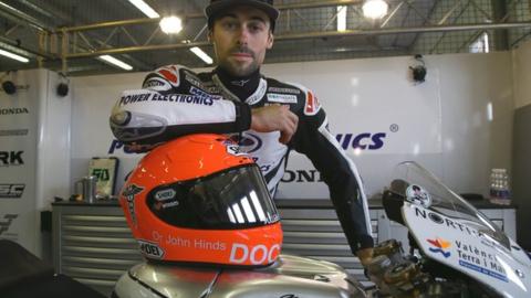 Eugene Laverty with the special helmet in tribute to Dr John Hinds