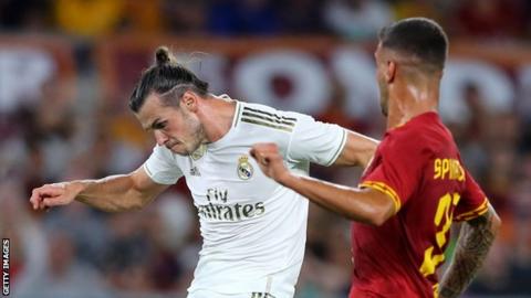 Gareth Bale (left) in action against Roma