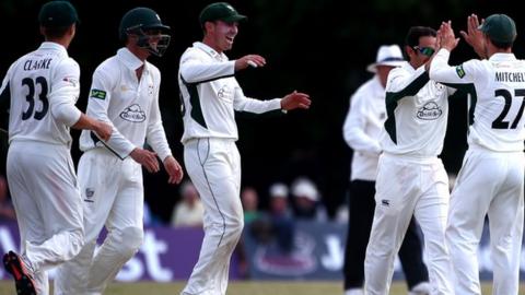 Saeed Ajmal is congratulated by his Worcestershire team-mates