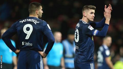 Aleksandar Mitrovic and Tom Cairney after Fulham's defeat by Brentford