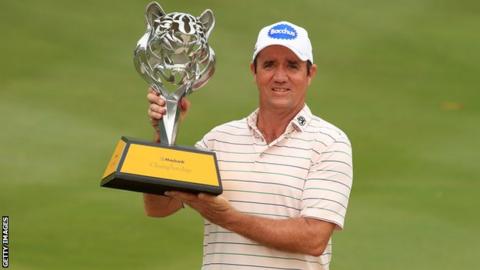 Scott Hend with the Maybank Championship trophy