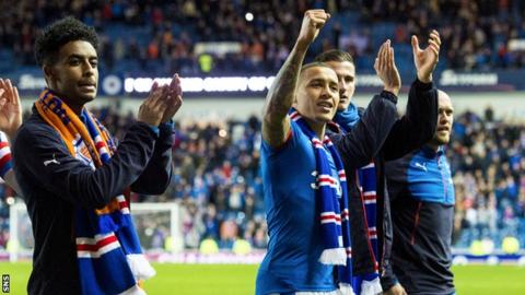 Rangers players celebrate winning promotion