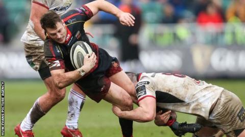 Josh Lewis of Dragons is tackled by Nick Timoney of Ulster