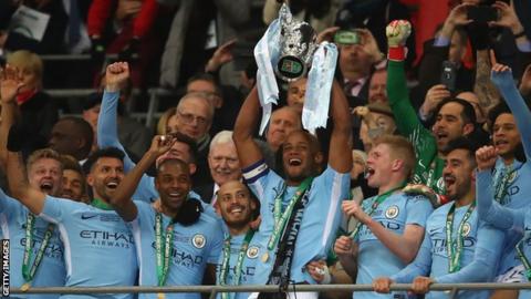 Manchester City captain Vincent Kompany lifts the Carabao Cup in 2018