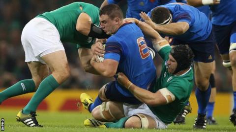 Sean O'Brien tackles Louis Picamoles during the 2015 World Cup match in Cardiff