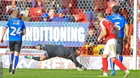 Josh Lillis saves Johnnie Jackson's penalty