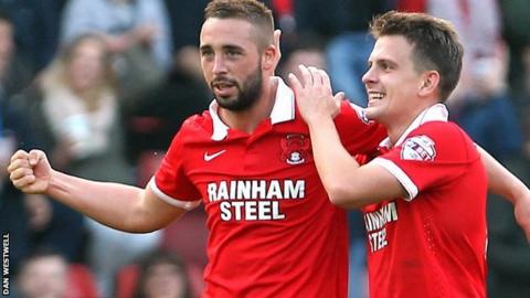 Sammy Moore (left) celebrates his second goal