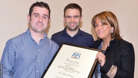 Louise Dunlop with her sons Michael and William (centre)