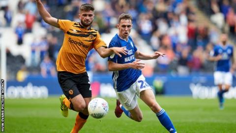 Hull's Brandon Fleming is chased down by Cardiff's Gavin Whyte