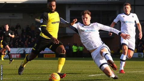 Burton's Darren Bent has a strike at goal against Millwall