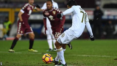 Carlos Bacca equalises for AC Milan from the penalty spot against Torino