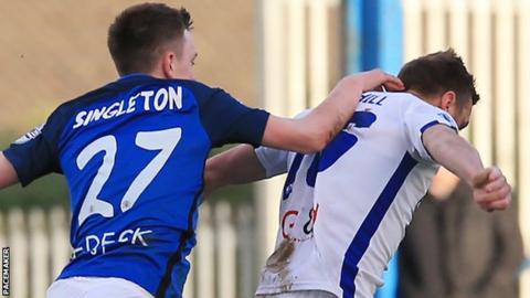 Glenavon's James Singleton was sent off for pulling back Ian Parkhill of Coleraine