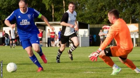 Former Glenavon and Ballymena forward James Costello bears down on goal for Rathfriland Rangers