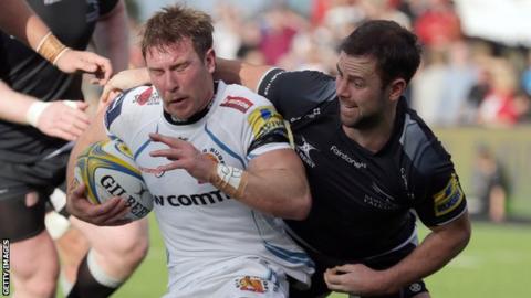 Exeter Chiefs' former Falcons half Will Chudley is tackled by opposite number Michael Young