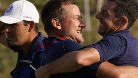 Ian Poulter and Rory McIlroy embrace