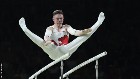 Nile Wilson on the parallel bars