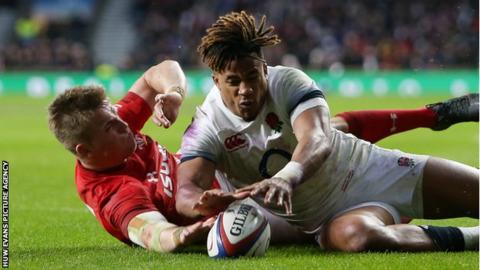 Gareth Anscombe (left) appears to touch the ball down despite pressure from Anthony Watson
