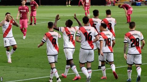 Rayo Vallecano's players celebrate scoring against Albacete as football resumed in Spain
