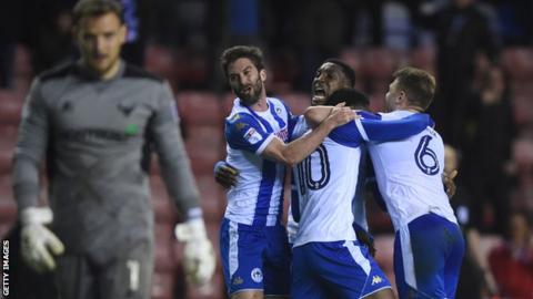 Will Grigg celebrates
