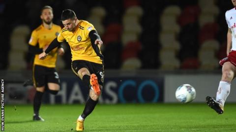Padraig Amond of Newport County tries a shot at goal