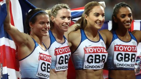 Zoey Clark (far left) and Eilidh Doyle (second from left) celebrate their silver medal with 4x400m relay team-mates Emily Diamond and Laviai Nielsen