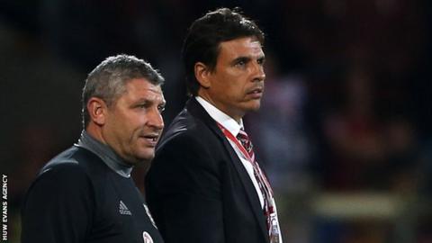 Osian Roberts and Chris Coleman watch Wales against Moldova in September, 2016