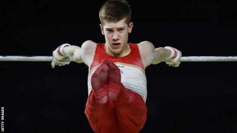 Dan Lee on the high bar