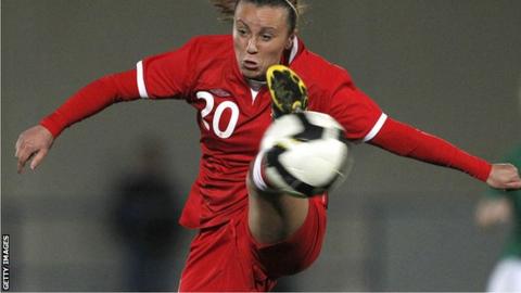 Natasha Harding controls a high ball during a Wales match