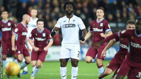 Swansea striker Wilfried Bony watches his penalty saved against Aston Villa