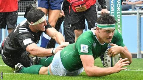 Max Deegan goes over to score Ireland's third try against New Zealand in Manchester