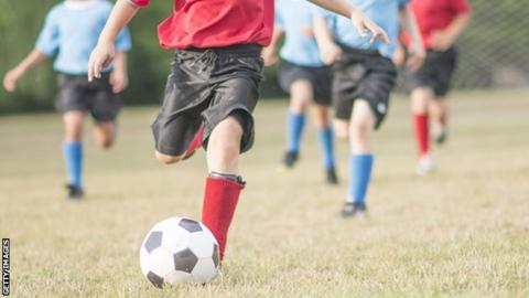 children playing football