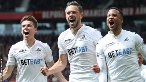 Gylfi Sigurdsson (centre) celebrates one of his nine goals for Swansea City this season