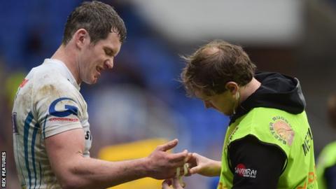 Ian Whitten is treated for a broken hand against London Irish