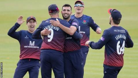 Lancashire's players celebrate Jimmy Anderson's run-out of Max Holden