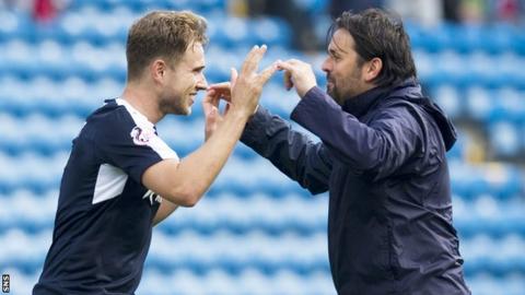 Paul Hartley (right) led his side to the top of the table with a 4-0 win at Kilmarnock