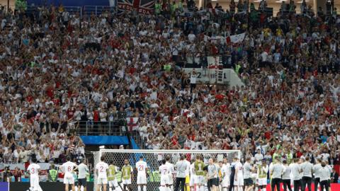 England fans try to console the players after defeat by Croatia