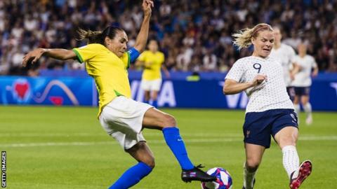 Brazil's Marta challenges with France's Eugenie Le Sommer