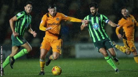 Josh O’Hanlon of Newport County gets past George Francomb