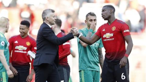 Ole Gunnar Solskjaer and Paul Pogba shake hands