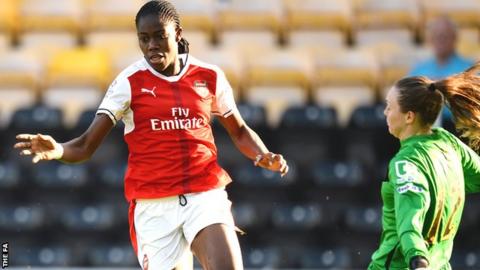 Asisat Oshoala of Arsenal Ladies goes past Notts Ladies goalkeeper Megan Walsh