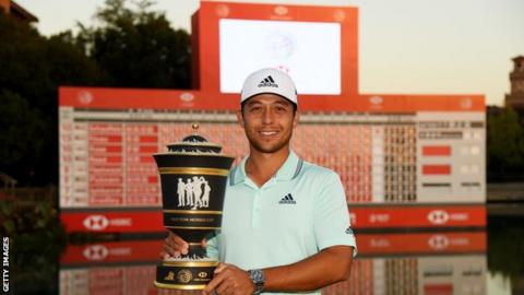 Xander Schauffele holds the WGC-HSBC Champions trophy